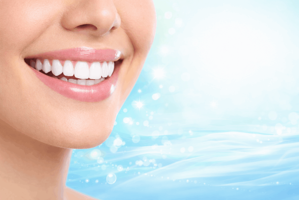 "Smiling mouth with healthy white teeth, representing natural oral health and fresh breath."